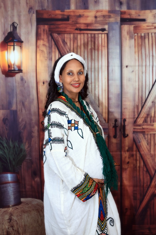 Maternity portrait in traditional white dress